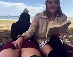 Girls on the beach enjoy anal plug without panties